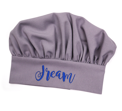 Personalized grey chef hat embroidered with the name "Dream" in navy script
