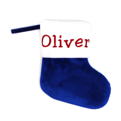 Royal blue velvet Christmas stocking embroidered with the name Oliver, on a white background