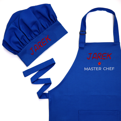 Personalized royal blue apron and chef hat set with straps spread out, embroidered "Master Chef" in red and white