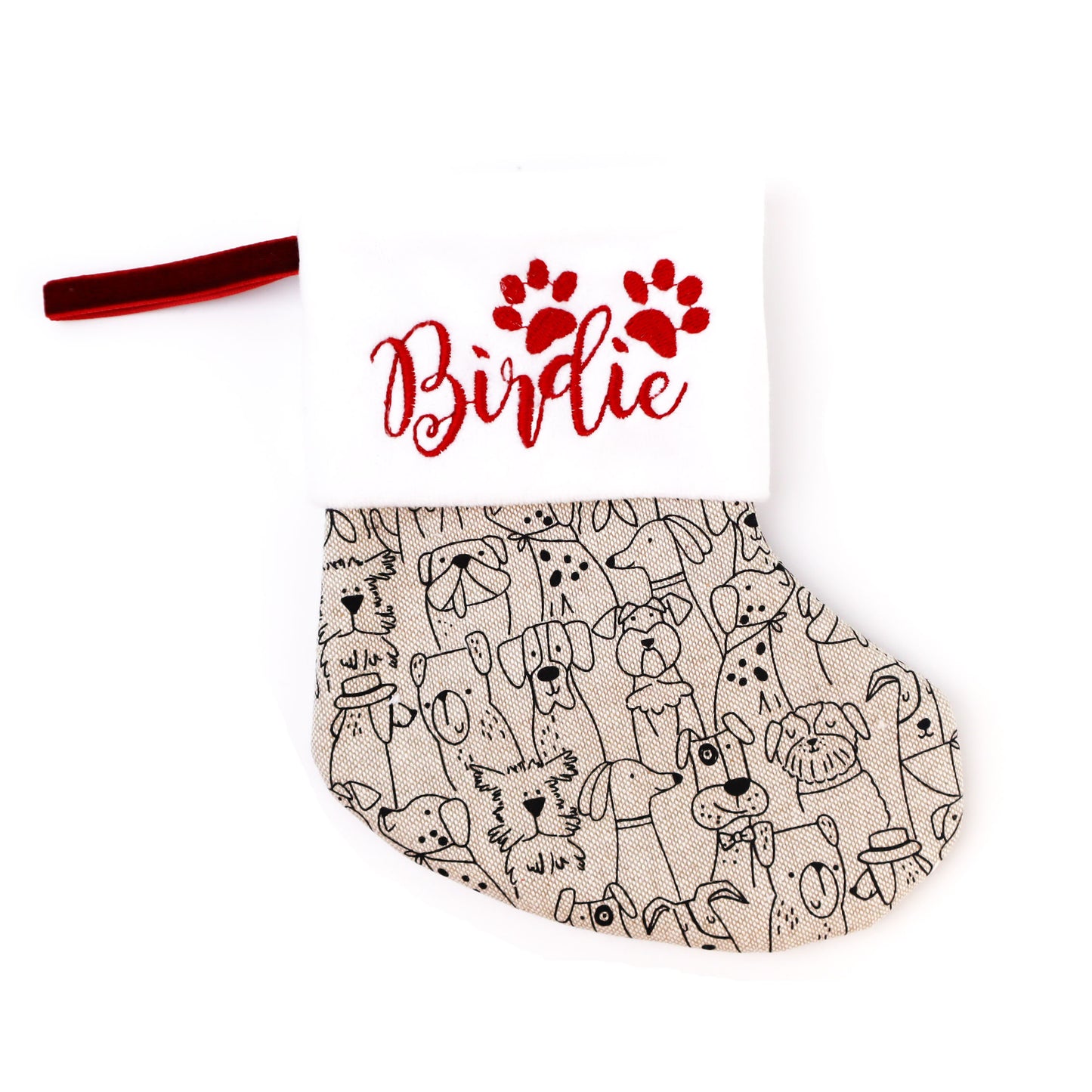 Linen mini Christmas stocking with a black and white dog print, embroidered with the name Birdie in red above a red paw print